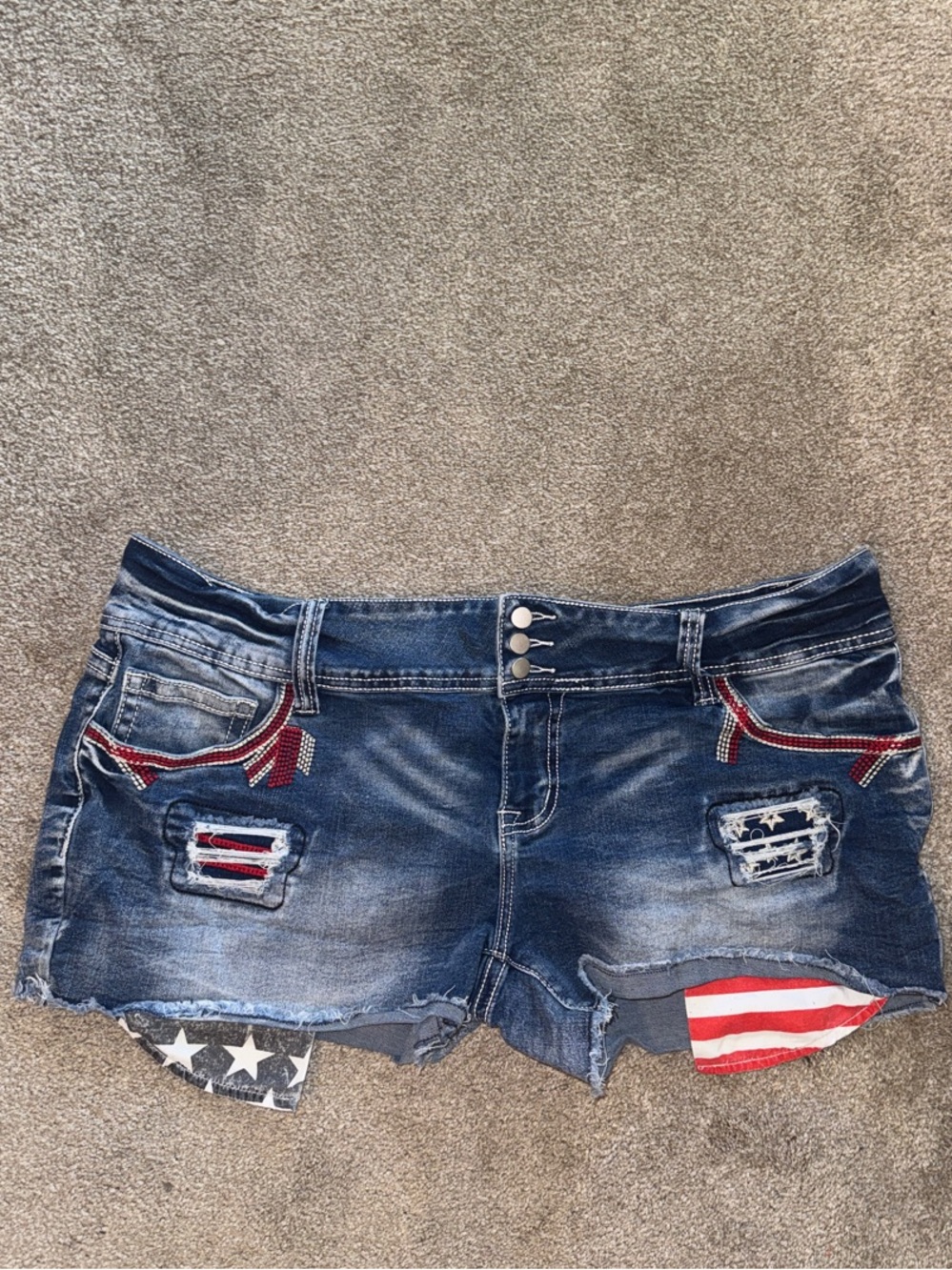 Women’s Distressed Blue Denim Shorts with Flag Patch Detail